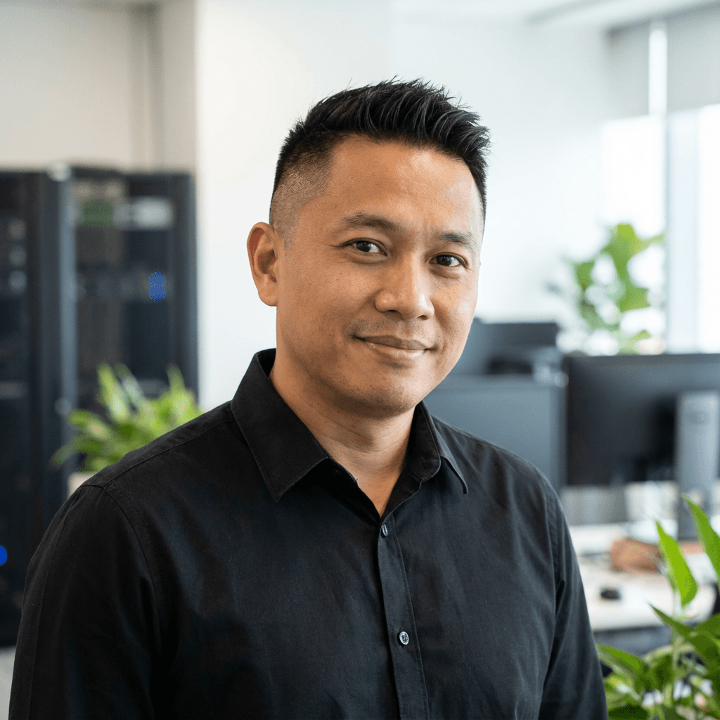 David Nguyen wearing a hard hat at a commercial facility